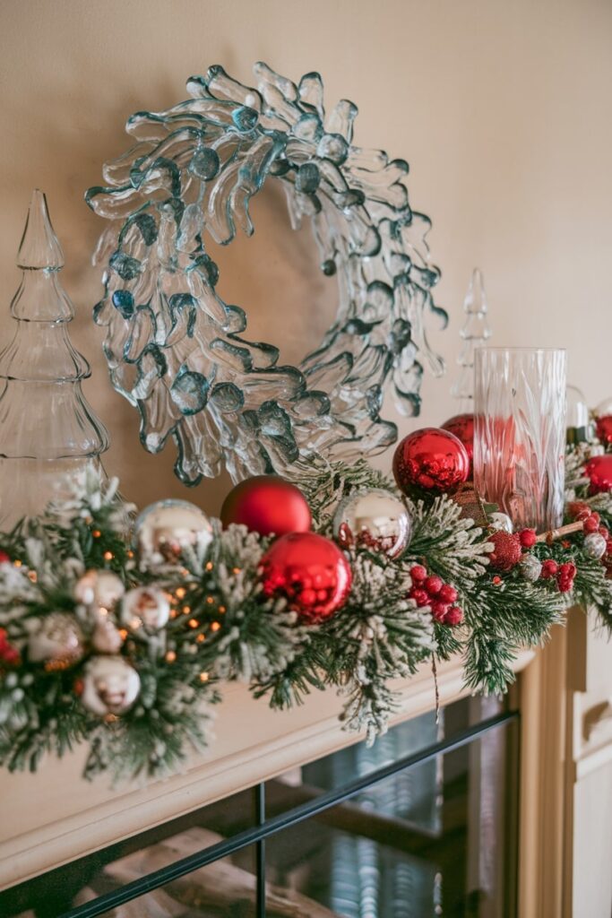 Christmas mantel with transparent glass decorations wreath and Christmas tree