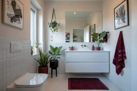 colors that go with burgundy, white bathroom with burgundy decor bottles, towels, bath rug