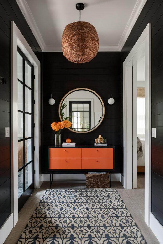 entryway with black color and orange decor, orange console table