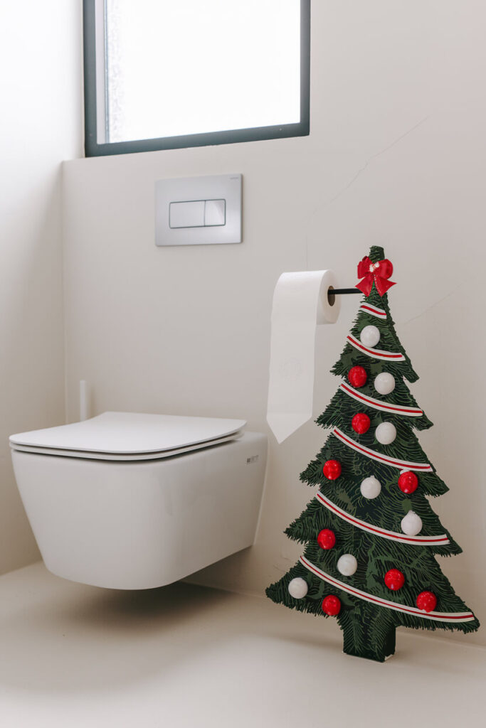 holiday-themed freestanding toilet paper holder in the form of a Christmas tree