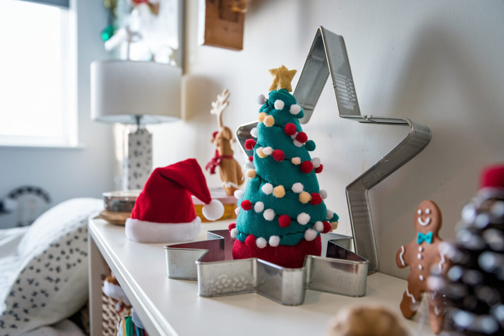 kid's bedroom with a handmade soft mini Christmas tree