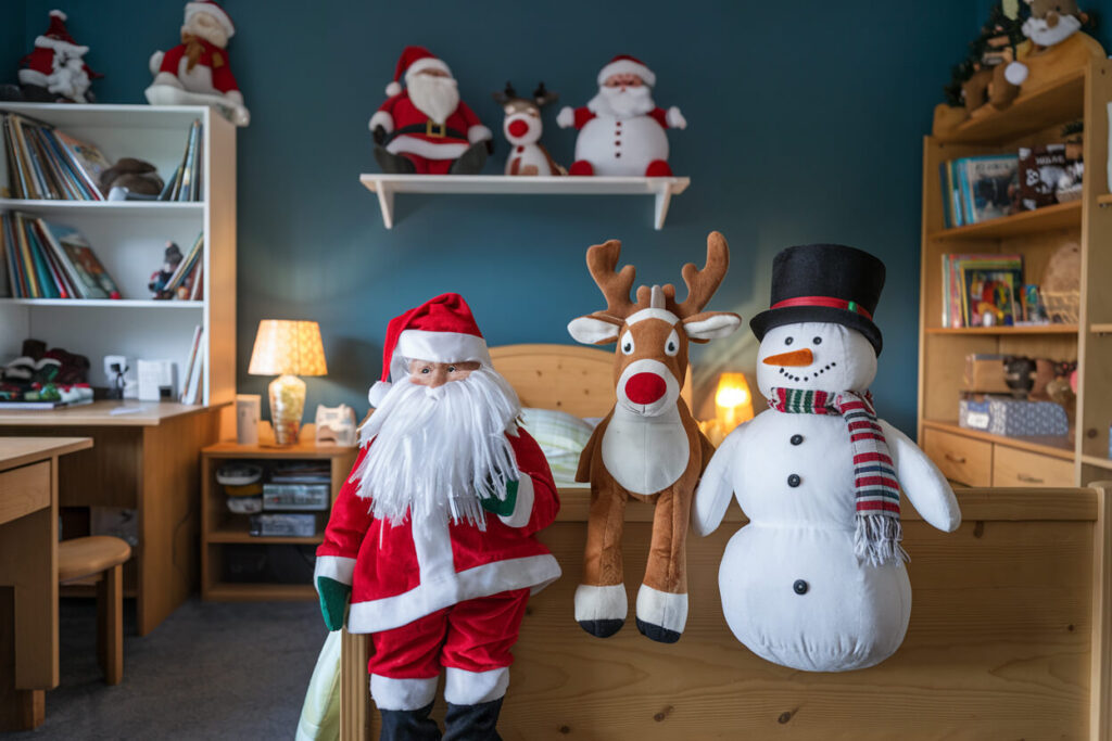 kid's bedroom adorned with plush toys for Christmas Santa, deer, snowman