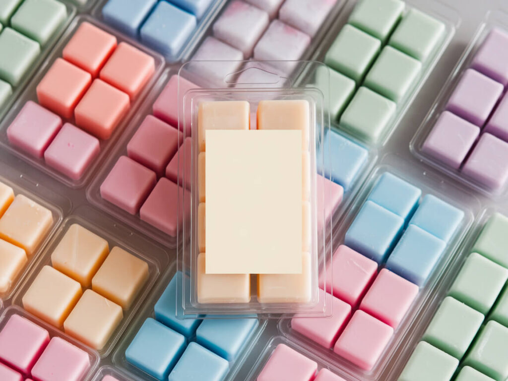 transparent packaging filled with wax melts and has blank label for the brand name