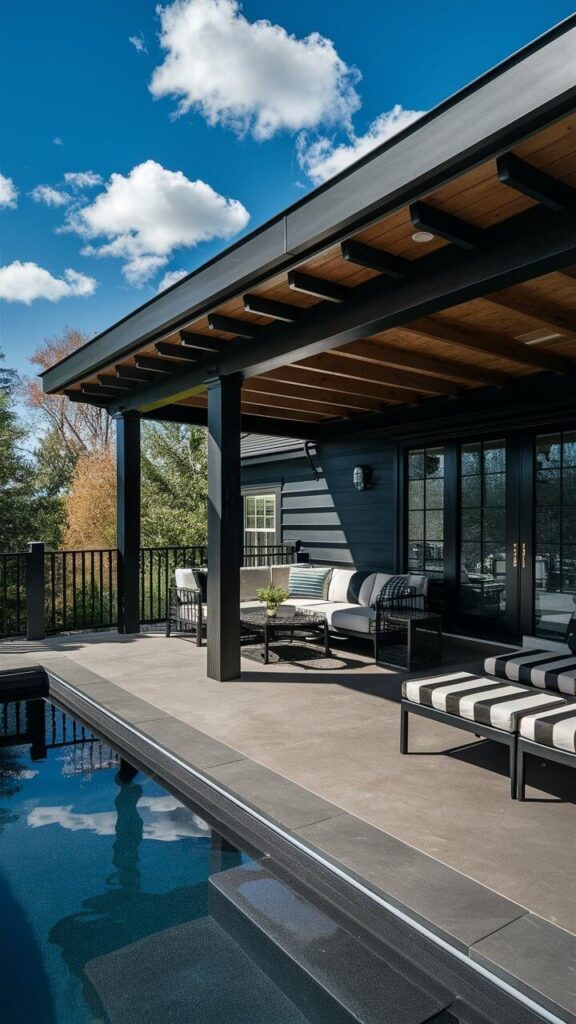 back porch with dark finishes and furniture, pool