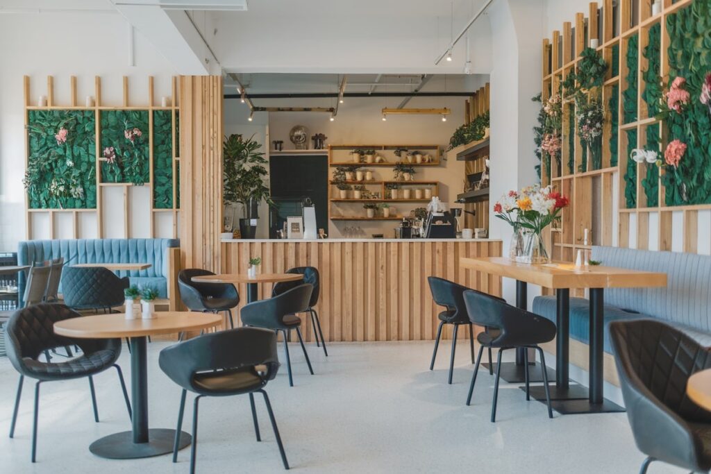 cafe interior with wooden elements and black chairs