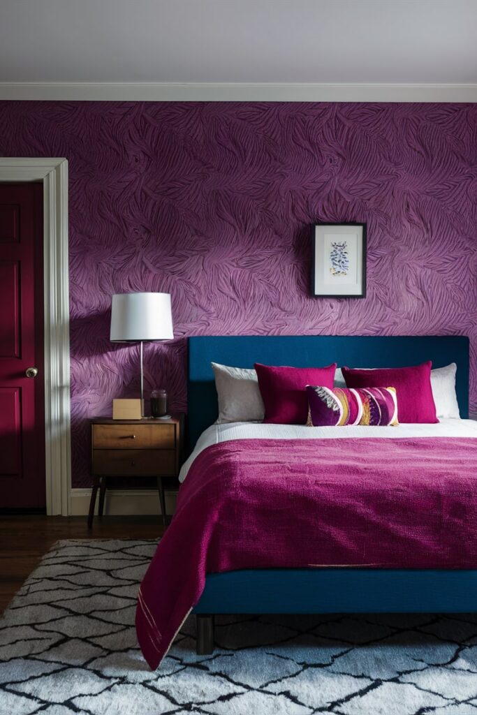 maroon and purple bedroom with wallpapers, blue bed, wooden bedside table