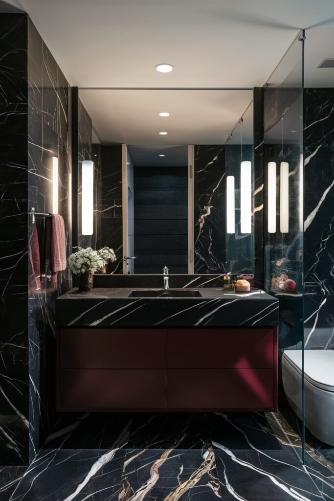 modern black marble bathroom with maroon vanity