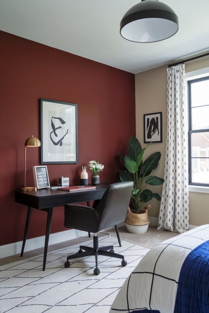 office guest room with maroon and taupe walls, black desk and office chair