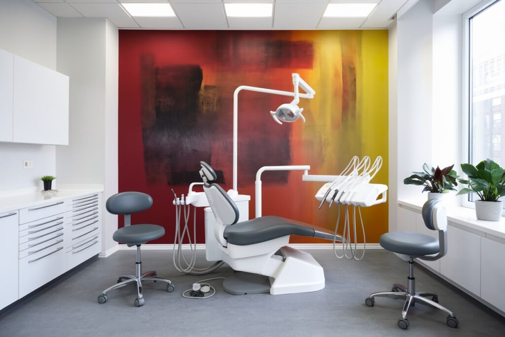 modern dental office interior, dental chair, red and yellow accent wall