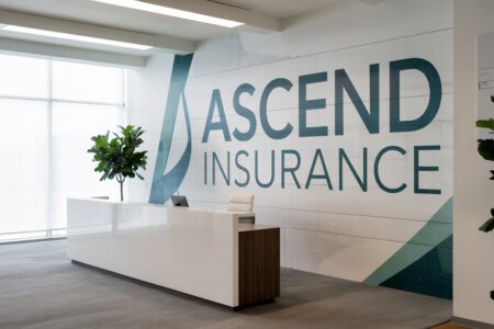 modern minimalist insurance company office with a logo on the wall