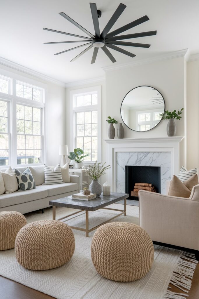 living room with neutral tones, black ceiling fan, summer decor, fireplace with marble