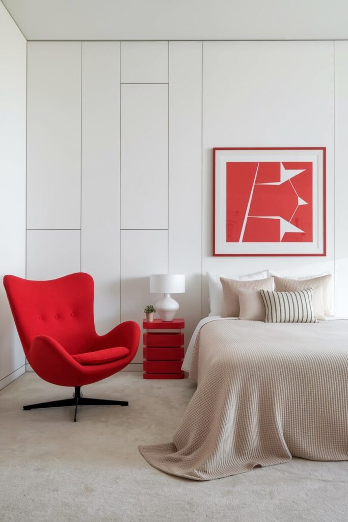 light modern minimalist bedroom with bright cherry red wall art, chair, and nightstand