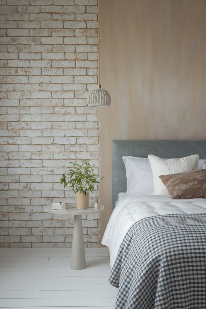 modern beige bedroom with limewashed brick wall