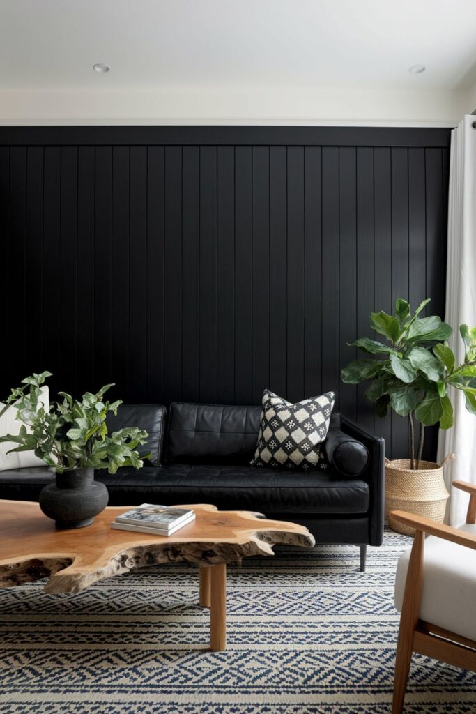 black living room with black leather sofa and live edge wood coffee table