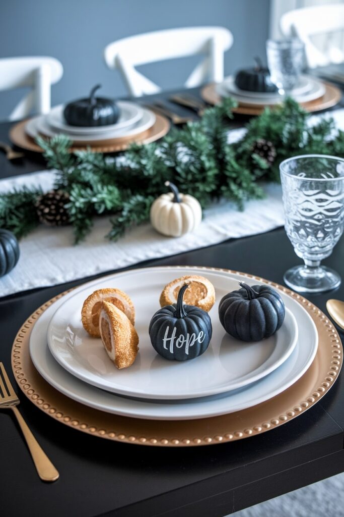 black mini pumpkins with names as personalized place cards on dining table, Thanksgiving decor