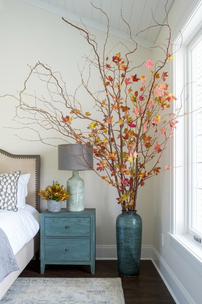 branch arrangement as fall decoration in the corner of the bedroom