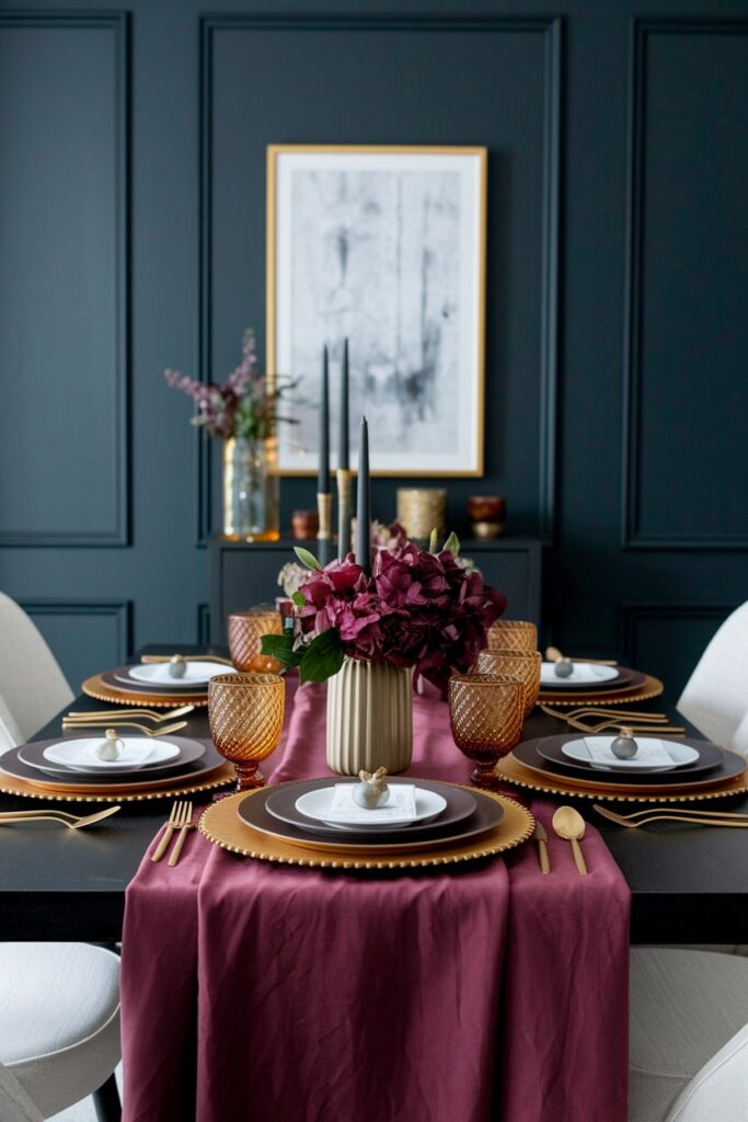 dining table in burgundy and gold palette with amber glassware as Thanksgiving decor