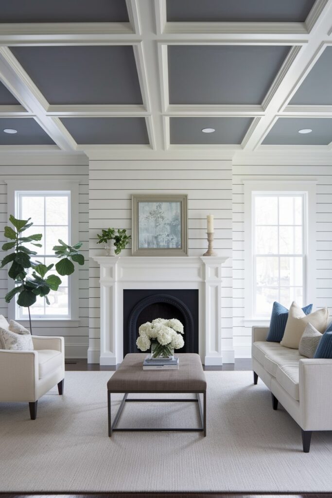 living room has white walls with shiplap, gray ceiling, and light furniture