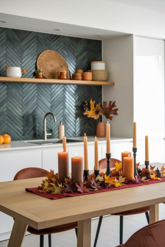 modern white kitchen with dark green backsplash, fall kitchen table decorations, rich-colored table runner, candles