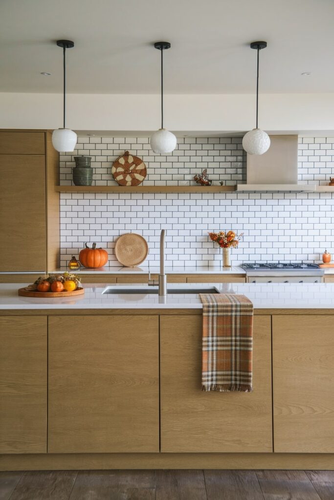 modern wooden kitchen with island and plaid dish towel as fall kitchen decor