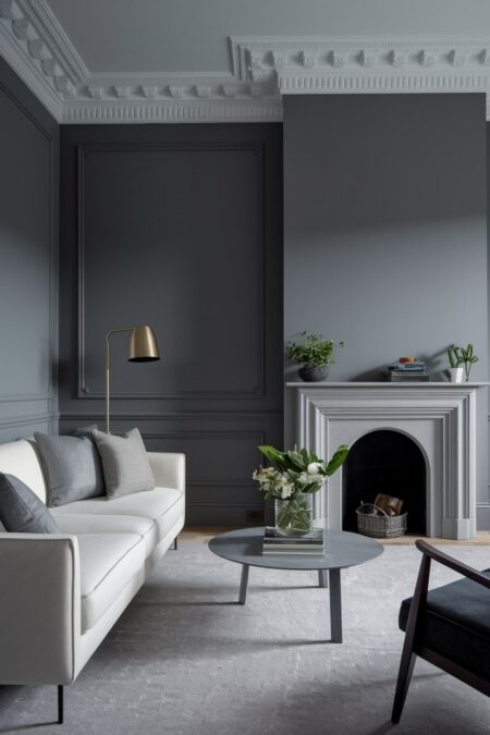 monochromatic gray living room with fireplace and light couch