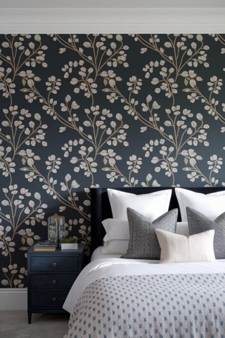 bedroom with dark floral wallpaper and dark headboard, light bedding