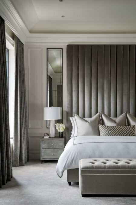 luxury bedroom with a high upholstered velvet headboard