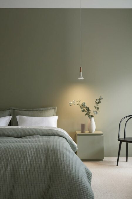 minimalist sage green bedroom with pendant lighting fixture