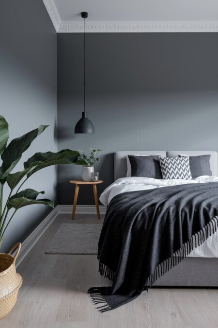sophisticated monochromatic gray Scandinavian bedroom with dark charcoal accents