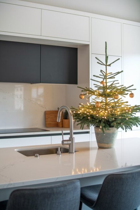tabletop tree with LED lights on the kitchen island as Christmas decor