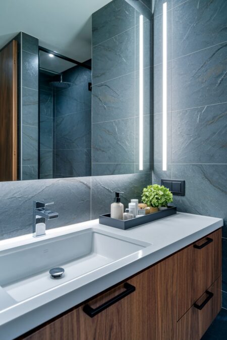 modern bathroom with a black minimalist tray organizer on the vanity top