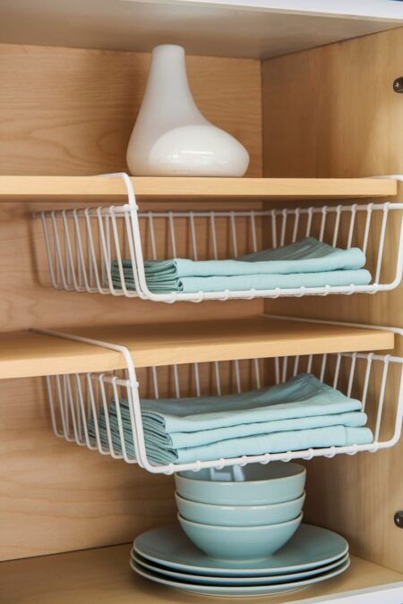 under-shelf wire baskets in the kitchen cabinet