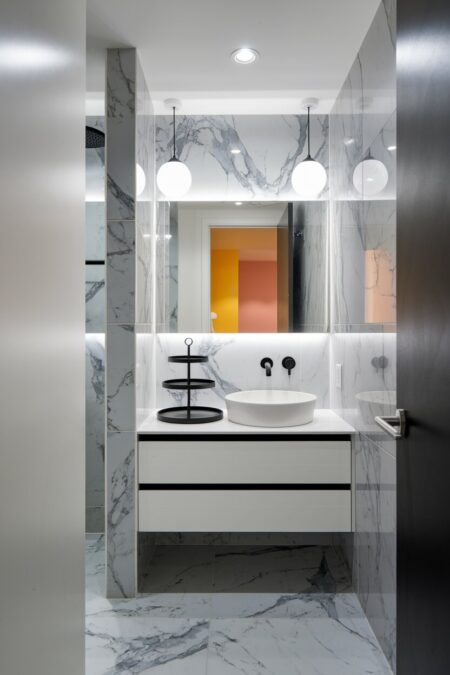 small bathroom with a tiered tray on the vanity top