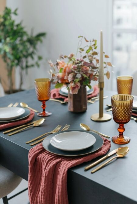 burnt orange napkins, gold flatware, and amber glassware as summer table decor