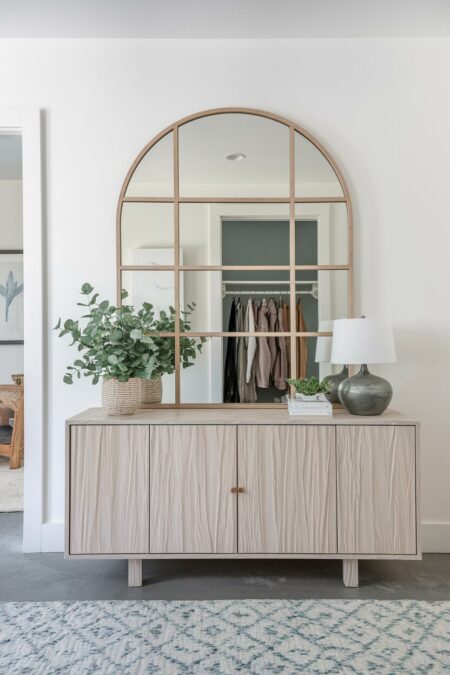 large light wood arch mirror as summer entryway decor