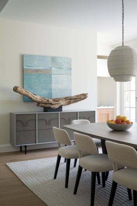 large piece of driftwood on a sideboard as summer dining room decor