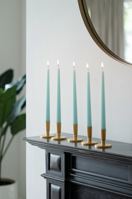 modern brass candle holders with sky blue taper candles as summer mantel decor