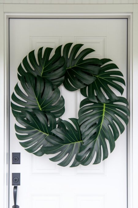 monstera leaf summer wreath on the white front door