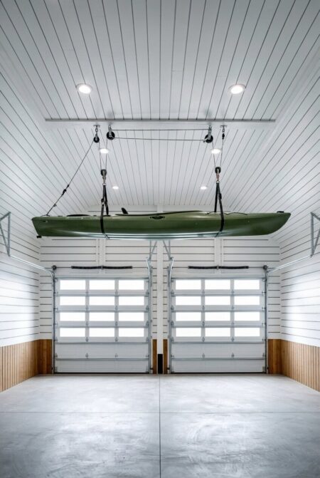 two door garage with an overhead pulley lift for kayak storage