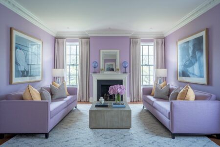 lavender living room with a fireplace, yellow and gray throw pillows, blue glass decor