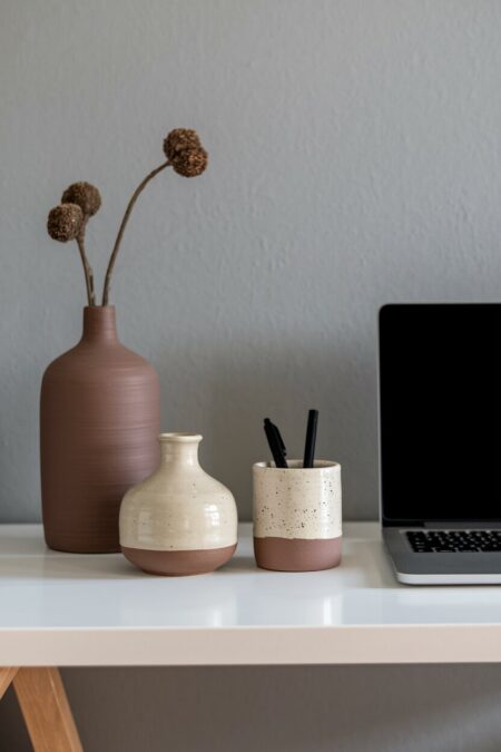 earthy home office handmade ceramic vases and pen holder on the white desk
