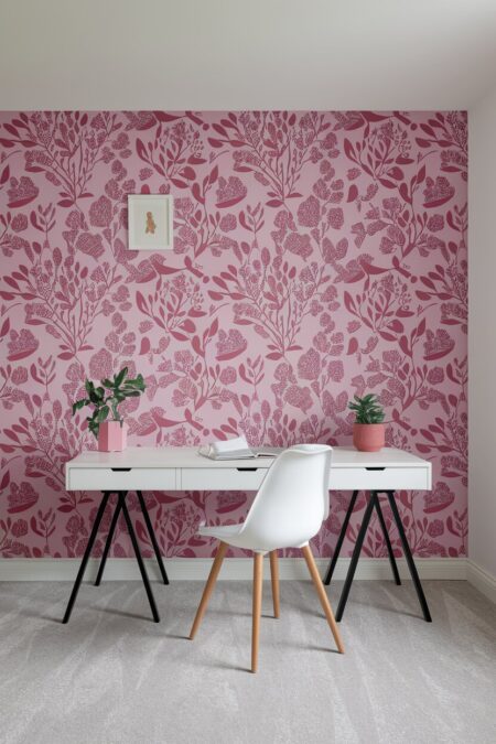 home office with a pink floral wallpaper and white desk