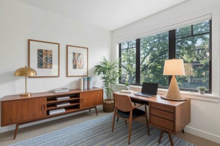 mid-century modern style home office with white walls and wooden furniture