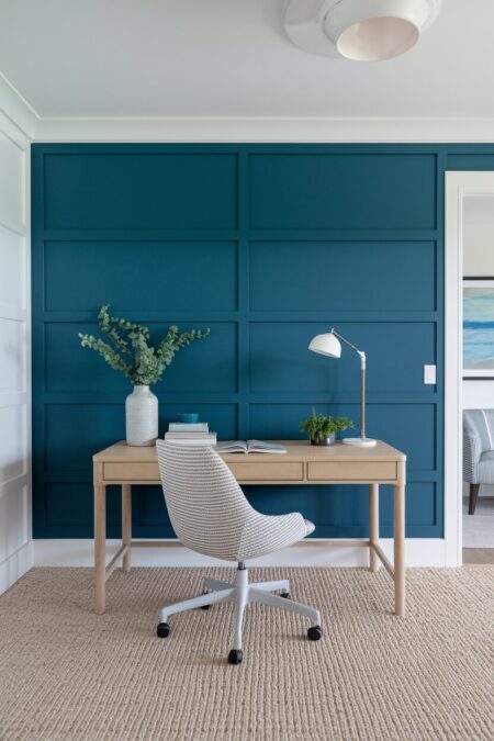 modern coastal home office with an ocean blue accent wall