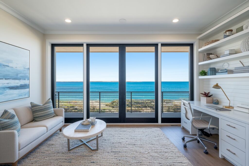 9 Coastal Home Office Ideas That Bring the Seaside to Your Workday modern coastal style home office with large windows