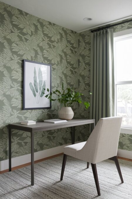sage green home office has a wallpaper with botanical print and minimalist furniture