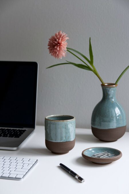 Japandi home office with handmade ceramics on the desk