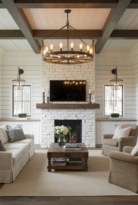 rustic living room with shiplap walls and a wagon-wheel chandelier