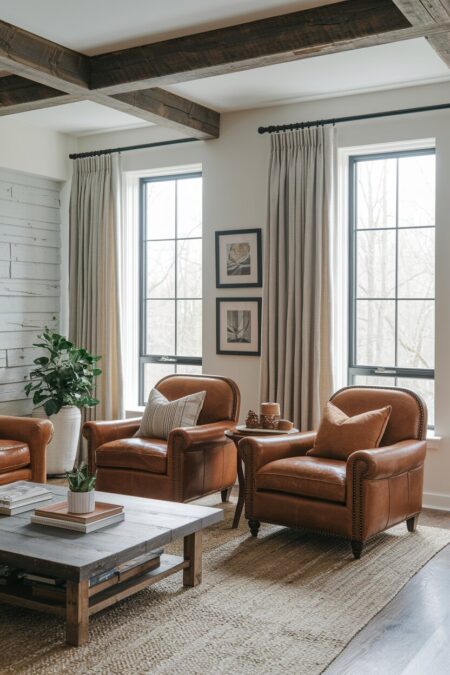 rustic living room with two brown leather club chairs