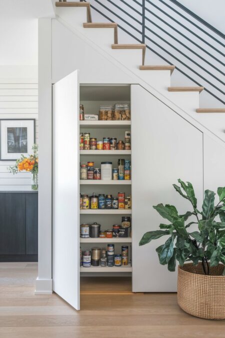 small pantry hidden under the stairs